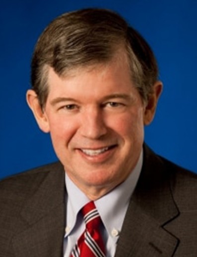 Male employee smiles for camera